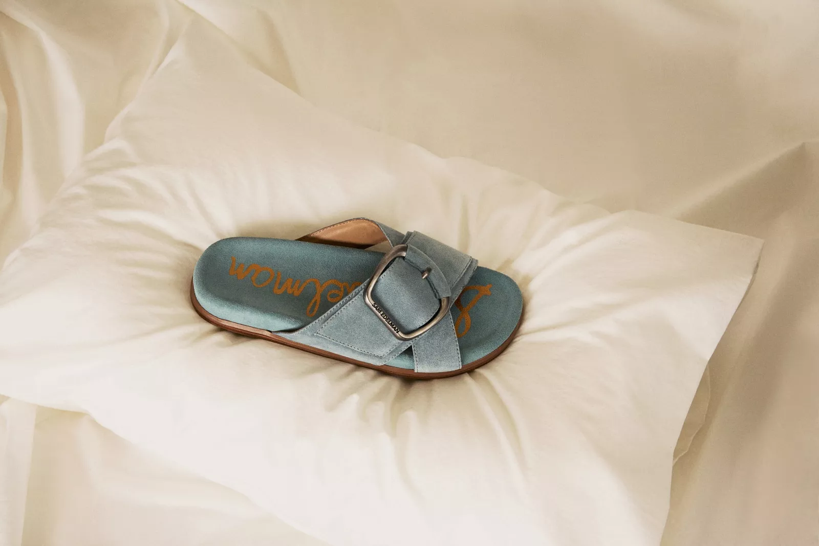 Sam Edelman sandal on a pillow